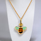 Gold set chain with enamel green bee