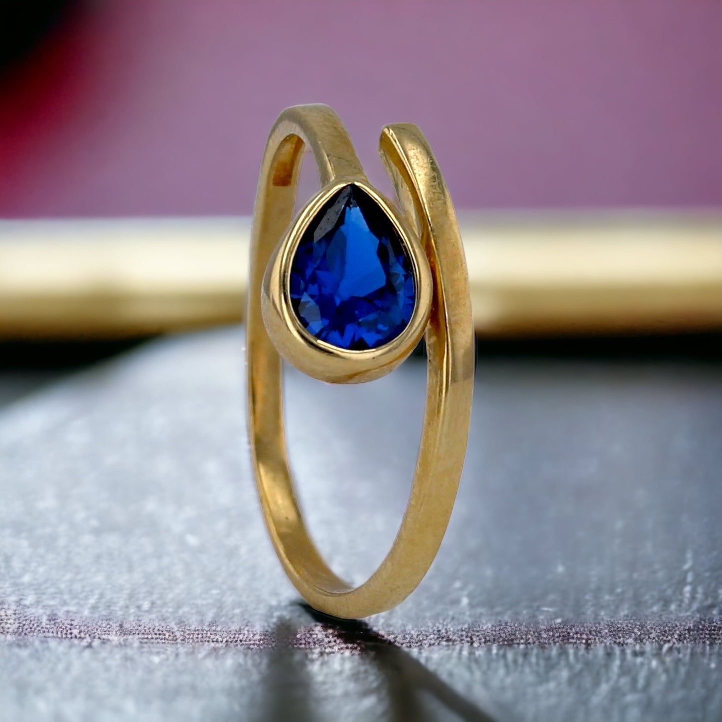 Yellow gold 10k blue drop ring